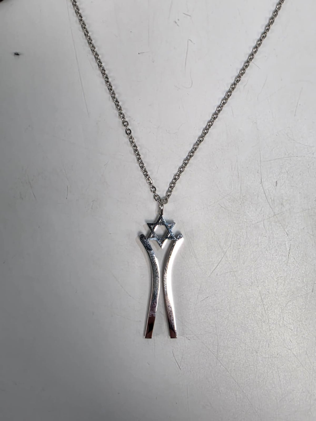 Star Dancer Pendant sterling silver chain flat lay