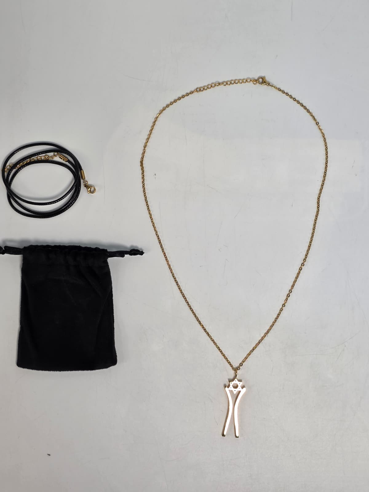 Star Dancer Pendant — full package with velvet pouch and chain options