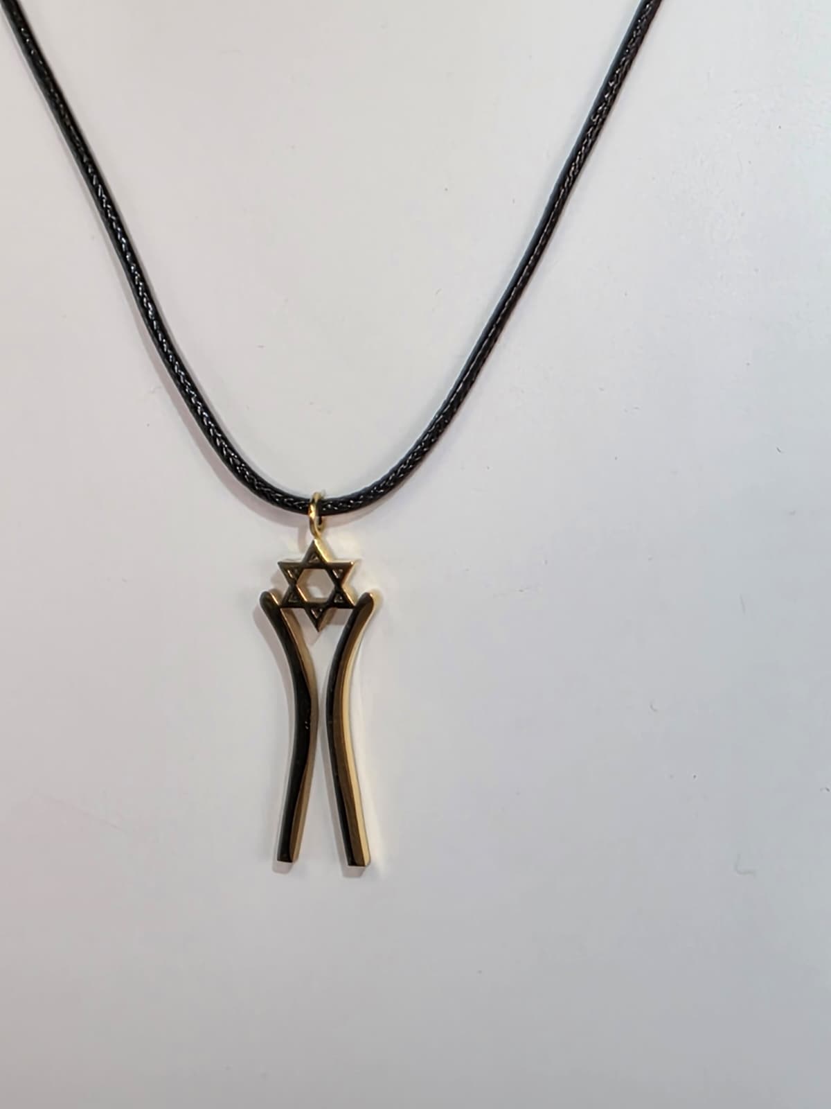 Star Dancer Pendant gold on leather cord close-up